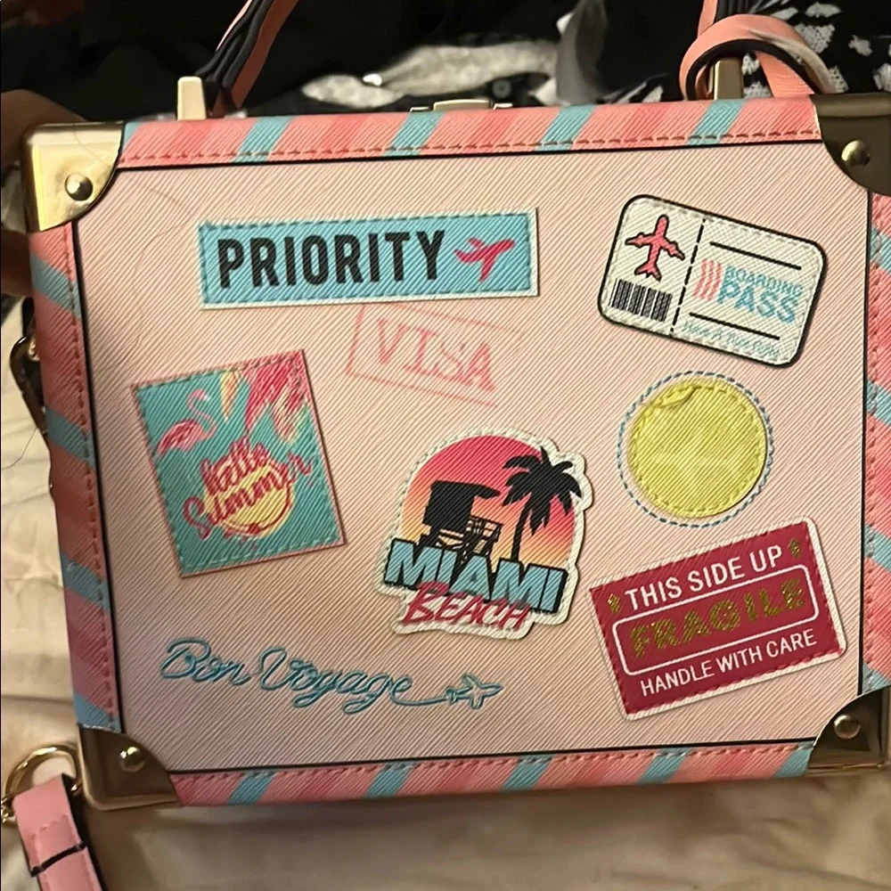 Stylish Travel-Themed Handbag with Pink and Blue Accents - Picture 1 of 10